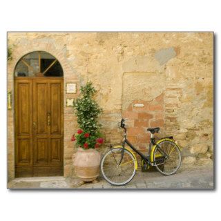 Bicycle Next to Flowers and Door Post Card