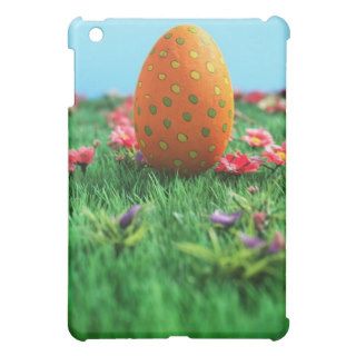 Decorated Easter egg amongst flowers on grass, Cover For The iPad Mini