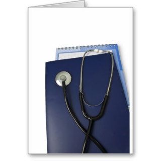 medical stethoscope on blue folder greeting cards