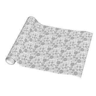 different gray snowflakes on white wrapping paper