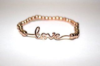 Stretch Bracelet 3mm 14kt Gold Filled Beads with Sterling Silver Love Charm with CZ Size 6.5 Inches Handmade Love Charm Available in All Three Golds Rose Gold, Gold, White Gold Plated Each Sold Separately Jewelry
