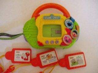 'Kid Clips' Music Player (plays both Disney and Sesame Street Kid Clips) and three Sesame Street Kid Clips cartridges Toys & Games