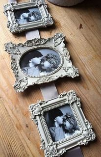 grey ornate triple frame by the hiding place