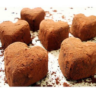 twelve handmade heart shaped chocolate truffles in decorated gift box by taylor's truffles