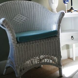 lloyd loom style chair by candle and blue