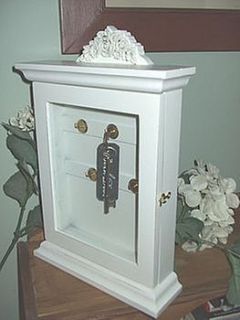 cream ornate key cabinet by the hiding place
