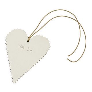 cream heart gift tag with string by the contemporary home