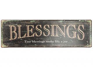 metal blessings sign by the contemporary home
