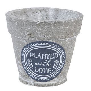 'planted with love' stone pot cover by the contemporary home