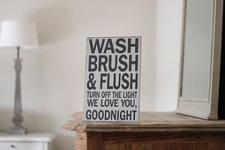 'wash brush & flush' sign by little red heart