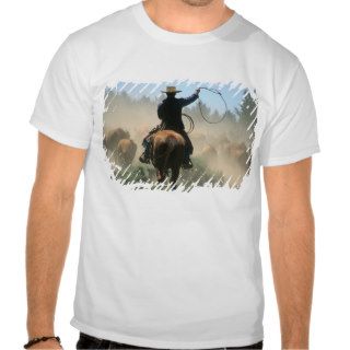 Cowboy on horse with lasso driving cattle tshirts