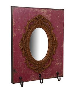 ornate mirror set in wooden board with hooks by horsfall & wright