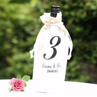 personalised table number wine bottle covers by beautiful day