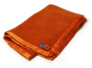 cuddly fleece baby blanket in bright orange by isabee