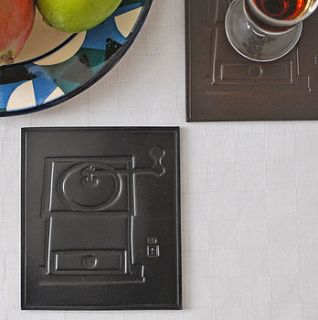 pair of leather coffee grinder coasters by sue lowday