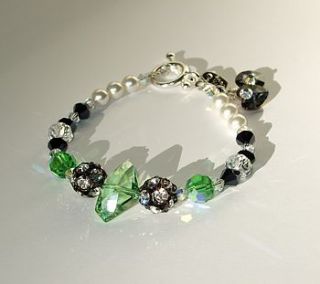 swarovski galactic shaped peridot coloured crystal bracelet by jre collection