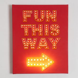 ‘fun this way’ illuminated sign by the playroom