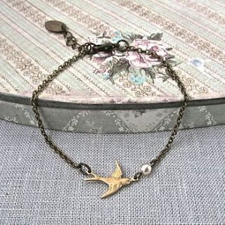 golden petite bird and pearl bracelet by gama