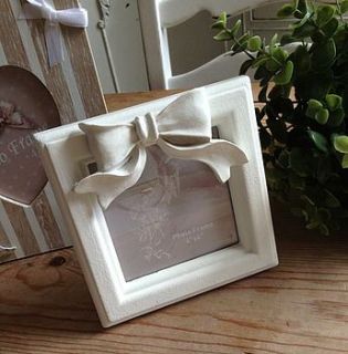 cream square 'bow' frame by the hiding place