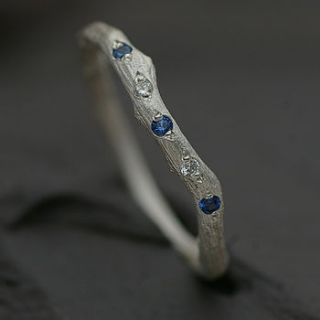eternity ring set with blue topaz and diamond by anthony blakeney