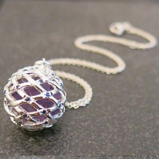 blue sapphire and amethyst pendant by kinnari
