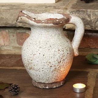 antique white earthenware pitcher by dibor