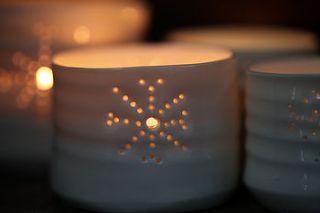 snowflake tea light holders by gemma wightman ceramics