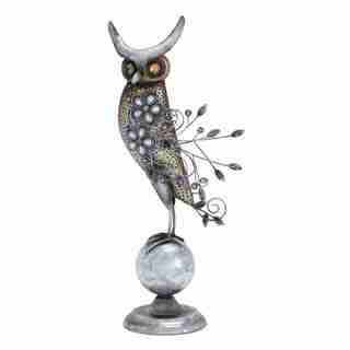 Metal Owl Perched On A Small Metal Globe