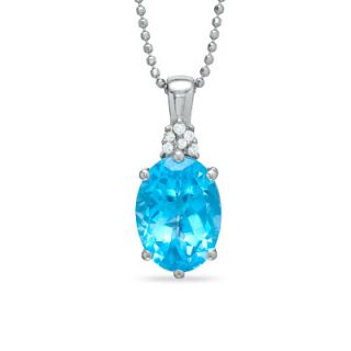 Oval Swiss Blue Topaz Pendant in Sterling Silver with Diamond Accents