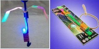 2011 BEST FLYING TOY  LED LIGHT Helicopter Sling Shot (JUST BEND BACK PART DOWN PUSH DOWN TO LIGHT UP AND SHOT FOR THE STARS   SUCH A NEAT TOY  HOURS OF FUN)   BUY A FEW THEY ARE ADDICTING  Sports & Outdoors