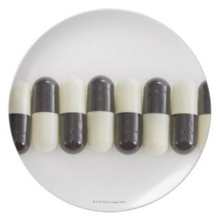 Row of Black and white pills Plate